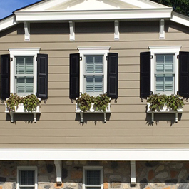 three window boxes on craftsman style home